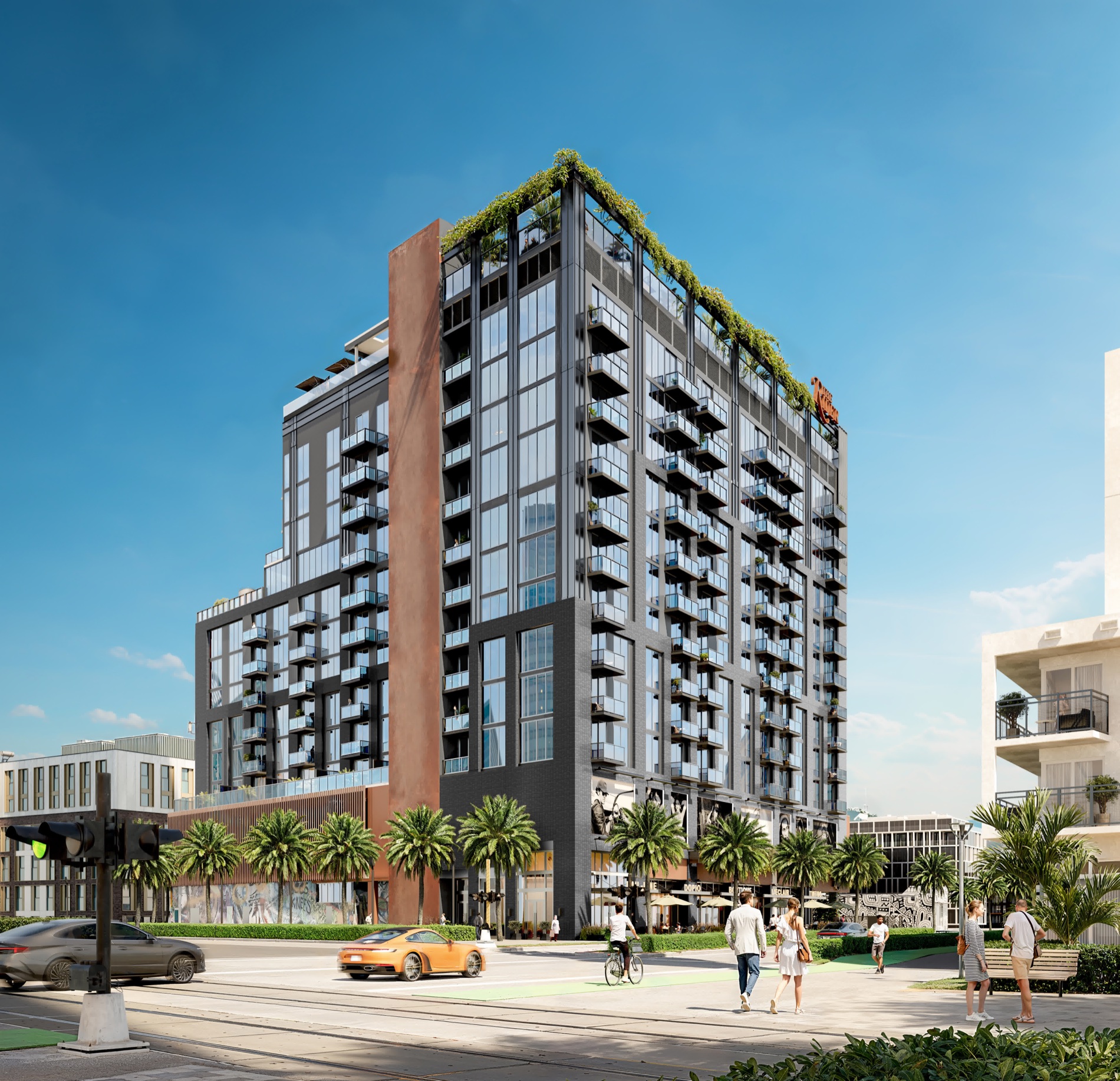 The Rider Residences in Wynwood by day — a design-forward Miami condominium with a rust-toned spine, cascading planted balconies, and a rooftop garden at 94 NE 29th Street, developed by Rilea Group with architecture by Deforma Studio.