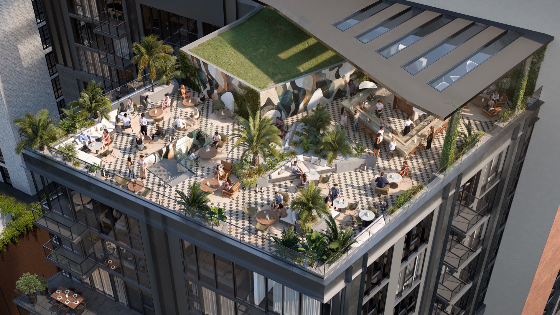 An aerial view of the rooftop deck at The Rider Residences Wynwood — a checkerboard-tiled terrace with a resort pool, cabanas, palms, a green lawn, and lounge seating high above the Wynwood streets.